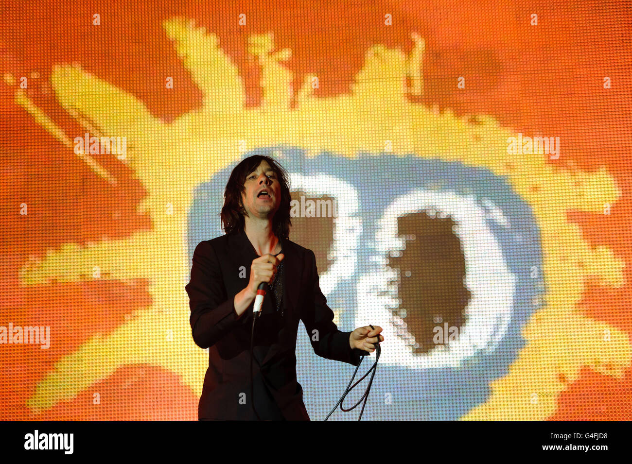 Bobby Gillespie of Primal Scream performs on the 4 Music stage at the V Festival in Chelmsford, Essex. Stock Photo