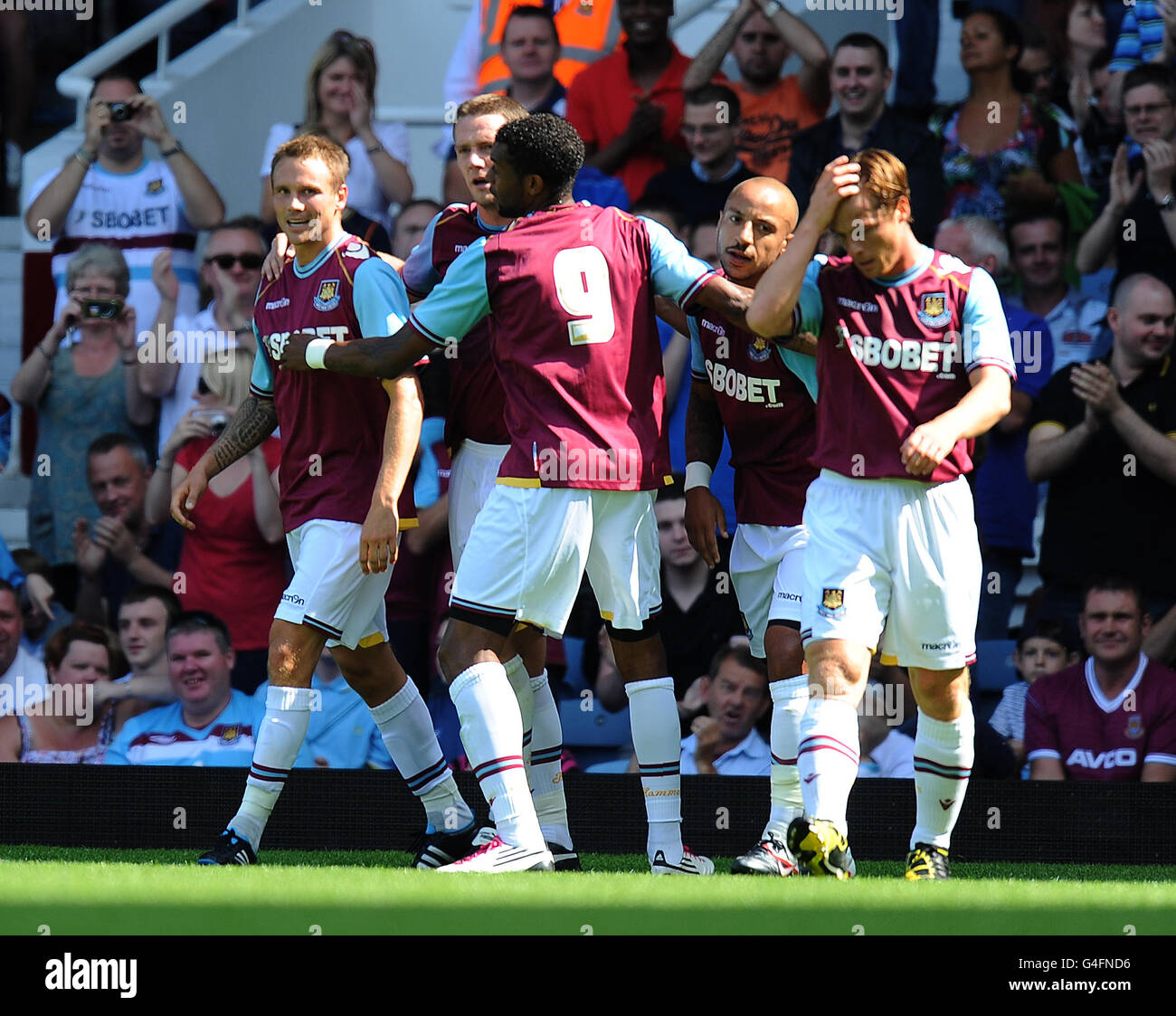 West Ham United's players congratulate Matt Taylor (left) after he scored their first gaol against Real Zaragoza Stock Photo