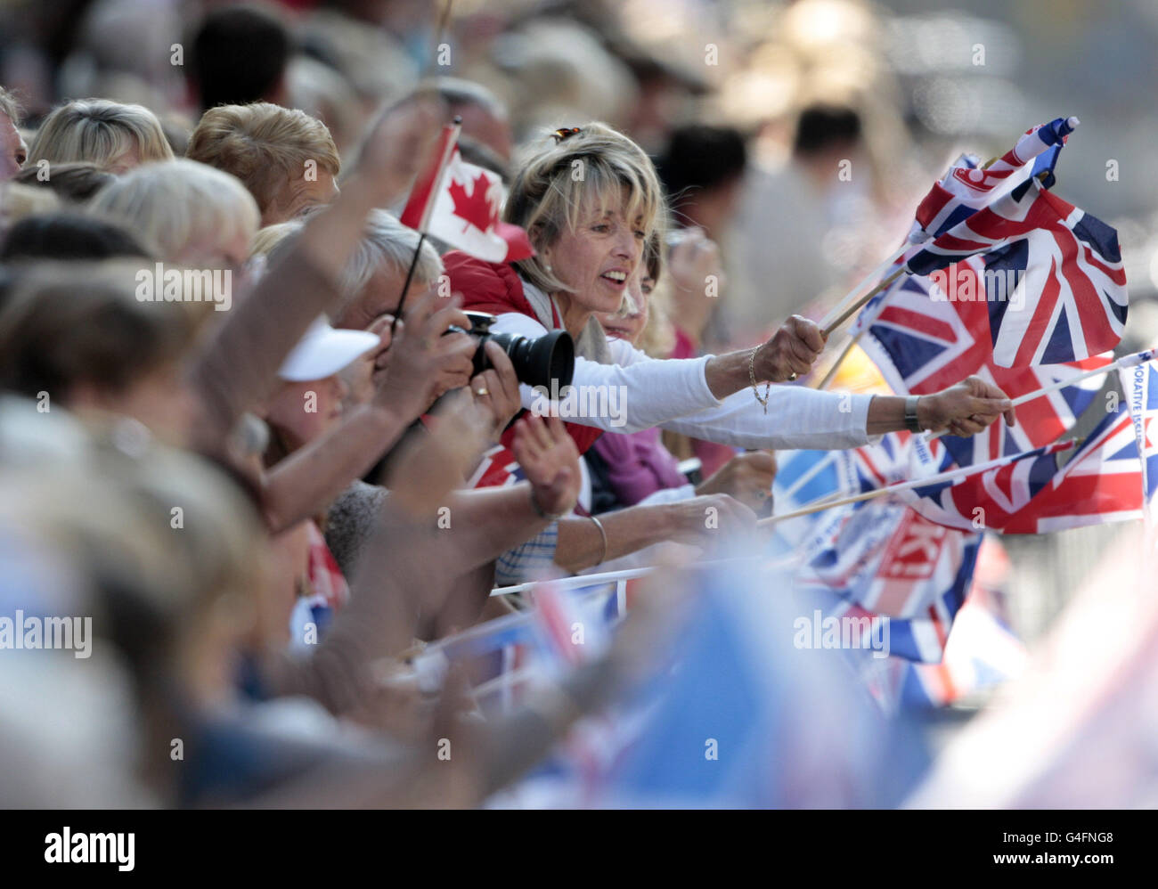 Crowds celebrate along the Royal Mile in Edinburgh after the wedding of Zara Phillips and Mike Tindall. Stock Photo