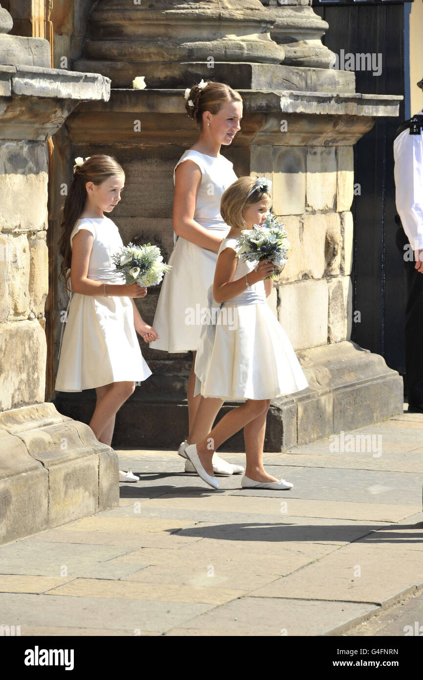 Unnamed bridesmaids leave the Palace of Holyroodhouse for the wedding of Zara  Phillips and Mike Tindall at Canongate Kirk Stock Photo - Alamy