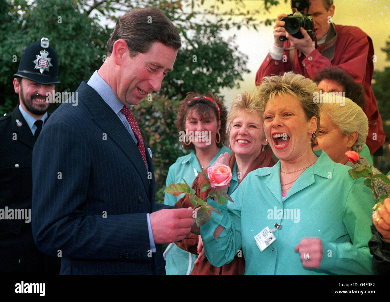 PA NEWS PHOTO 14/11/91 WARD ORDERLY LESLEY GREEN (34) FROM HARLOW, ESSEX GIVES PRINCE CHARLES A ROSE TO MARK HIS 43RD BIRTHDAY AFTER HE VISITED THE TOWN'S HOSPITAL Stock Photo