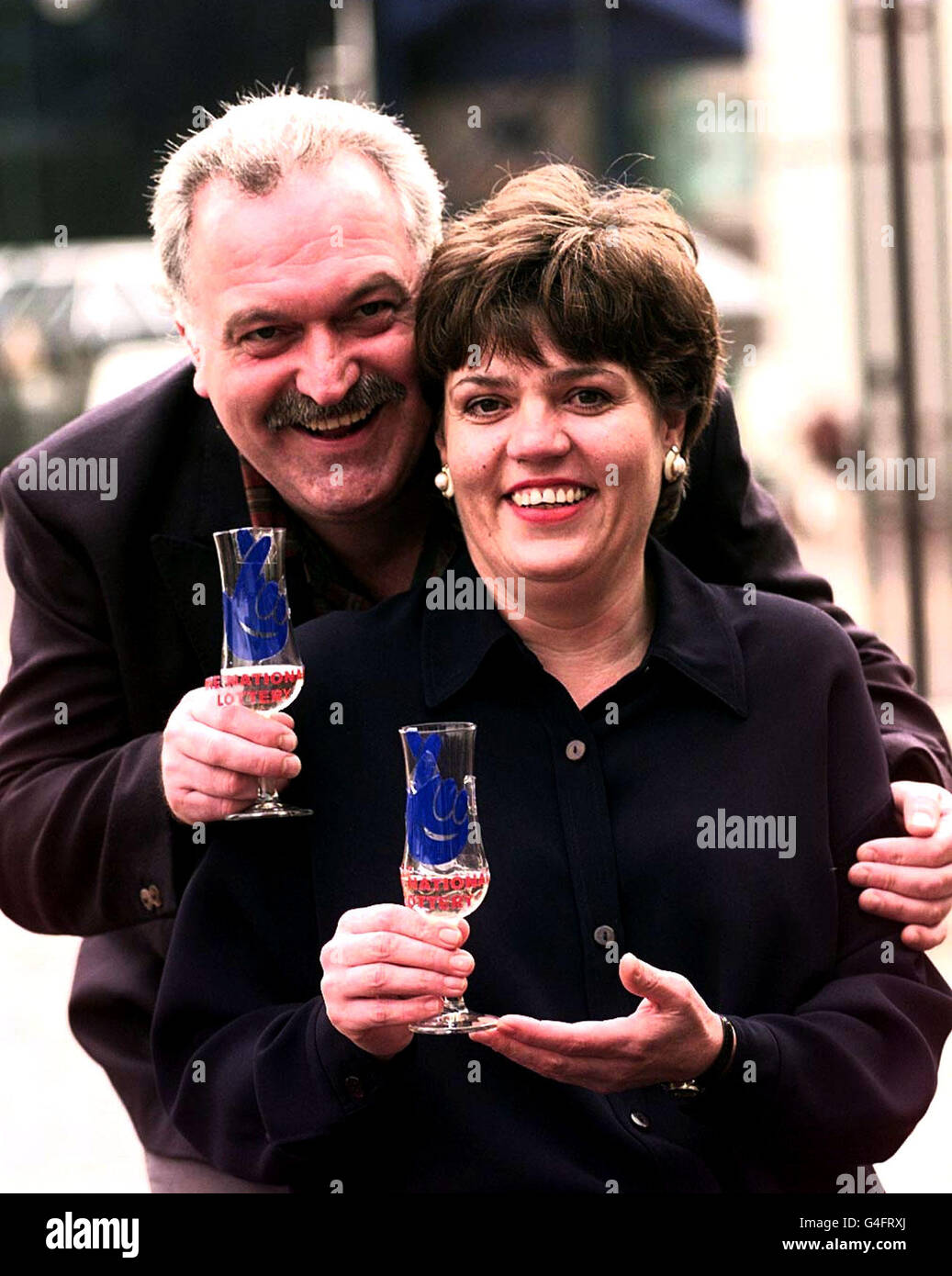 Lottery jackpot winners Kevan Moss and his partner Vivienne Mole, from Daventry, after receiving their cheque for 6 million in BIrmingham today (Monday). They won a half share of last Saturday's jackpot. Picture by David Jones/PA *EDI* Stock Photo