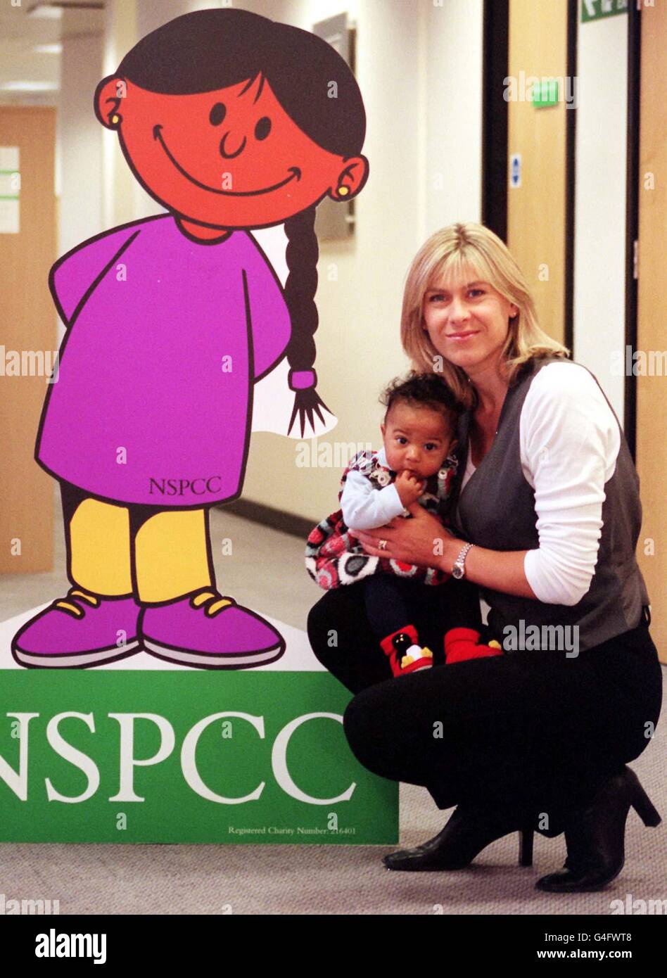 Former Olympic swimmer turned TV presenter Sharron Davies and her four-month-old daughter Grace, at the NSPCC (National Society for Prevention of Cruelty to Children) National Centre in London this morning, the mother-of-two told the launch of 'The pack to help parents not smack', she had occasionally given four-year-old Elliott a slight tap. But said four-month-old Grace, bouncing happily on her knee as she spoke, was still young to be disciplined. See PA Story SOCIAL Smack. Photo by Mathew Fearn/PA. Stock Photo