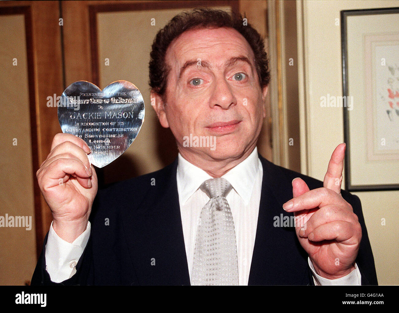 New York comedian, Jackie Mason, with is Variety Club Silver Heart at the Dorchester Hotel in London today (Weds), where the Variety Club held a Tribute Lunch in his honour, in recognition of his outstanding contribution to showbusiness. Photo by Stefan Rousseau. Stock Photo