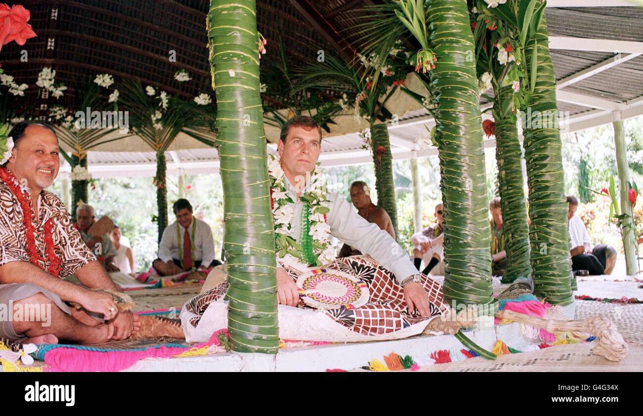 The Duke of York sit's in the shade of a Fale (open sided tin hut), before taking part in a traditional dance ceremony in Apia, the capital of Samoa. The Duke was dressed in grass skirt, and with a mat over his legs as he was made a Samoan chief today (thursday). PHOTO BY JOHN STILLWELL/PA. Stock Photo