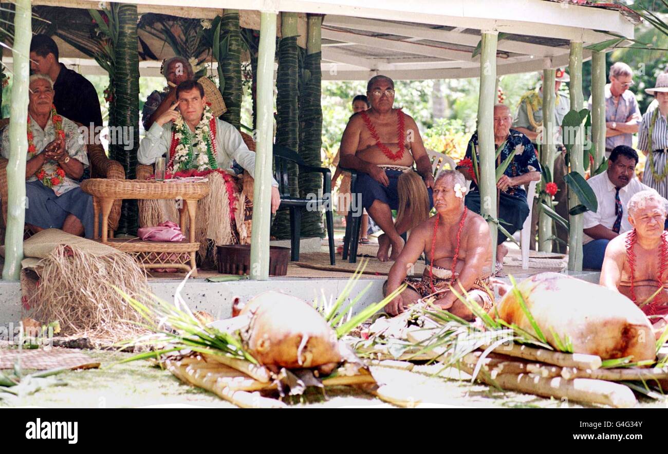 The Duke of York sit's in the shade of a Fale (open sided tin hut), as a lunch of 2 roasted pig's were laid before him. The Duke later took part in a traditional dance ceremony in Apia, the capital of Samoa. The Duke was dressed in grass skirt, and with a mat over his legs as he was made a Samoan chief today (thursday). PHOTO BY JOHN STILLWELL/PA. Stock Photo