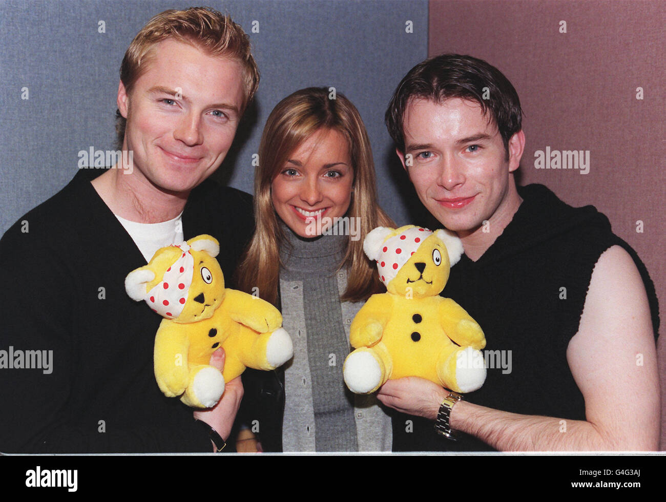 Boyzone stars Ronan Keating (left) and Stephen Gately join singer Louise at Broadcasting House today (Friday) as this year's Children In Need appeal gets under way. Photo by Peter J Jordan/PA Stock Photo