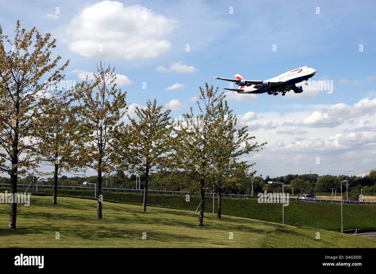 A British Airways plane lands over trees at Heathrow Airport in West London PRESS ASSOCIATION Photo. Picture date: Monday August 22, 2011 See PA story . Photo credit should read: Steve Parsons/PA Wire Stock Photo