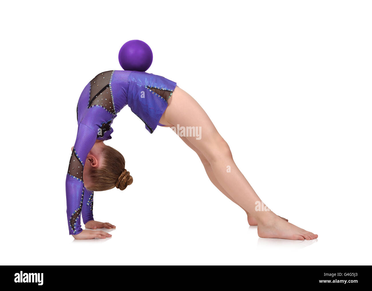 young girl in blue clothes doing gymnastics with ball, isolated on ...