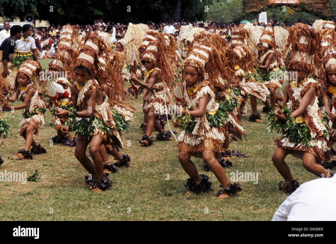 Tongan children dancing during a feast in honour of Queen Elizabeth II at Mala'e Pangai, in Nuku&#699;alofa, the capital of Tonga. Stock Photo