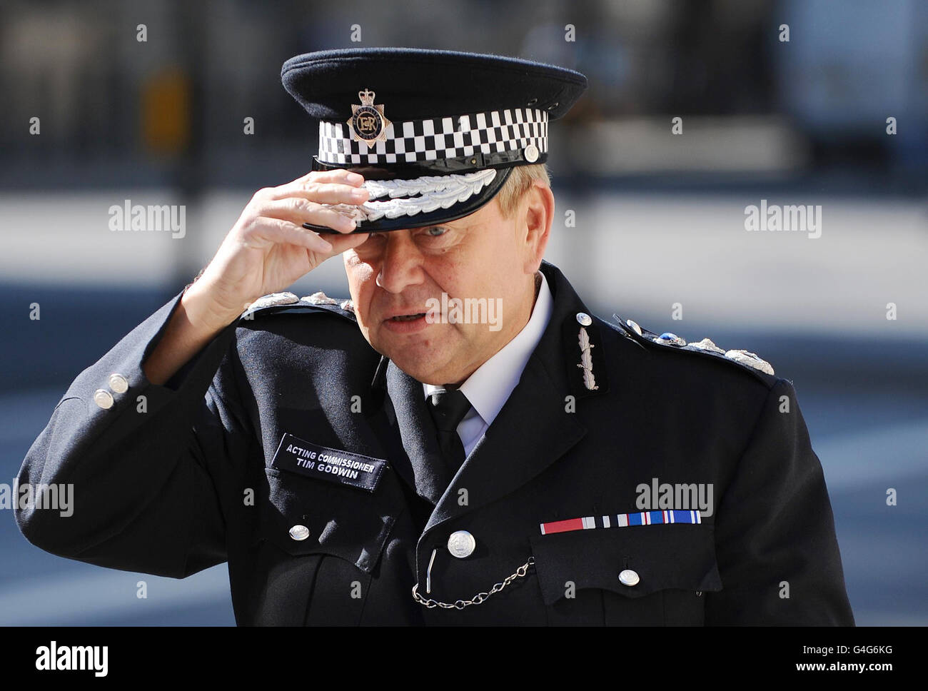 Acting Metropolitan Police Commissioner Tim Godwin arrives for a meeting of Cobra, at the Cabinet Office, Westminster, London. Stock Photo