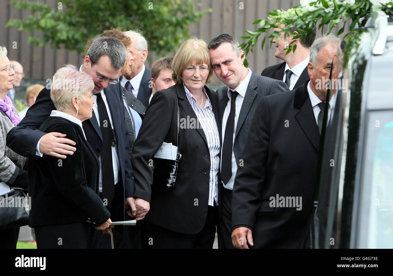 Family members at the funeral of Belfast journalist James Kelly, from St Brigids in south Belfast, at St Brigid's Church on Belfast's Malone Road, he died shortly after celebrating his 100th birthday. Stock Photo