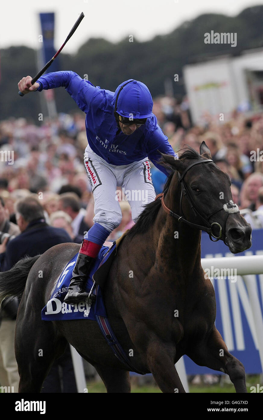 Blue Bunting ridden by Frankie Dettori celebrates victory in the Darley Yorkshire Oaks during the Ebor Festival 2011 at York Racecourse. Stock Photo