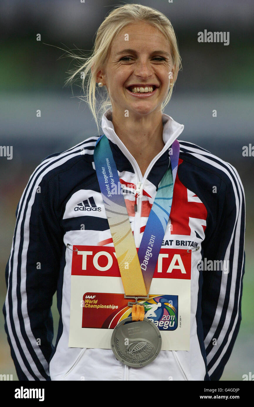 Great Britain's Hannah England smiles as she wears her silver medal ...