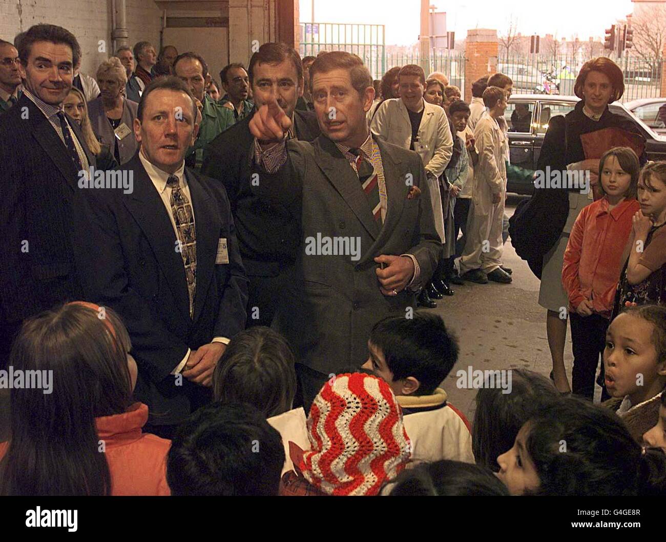 The Prince of Wales talks with pupils from Grangetown infants school during a visit to Track 2000 Community Resources Centre in Cardiff this morning December 17, 1998. WPA ROTA photo by DAVID JONES/PA*ED* Stock Photo