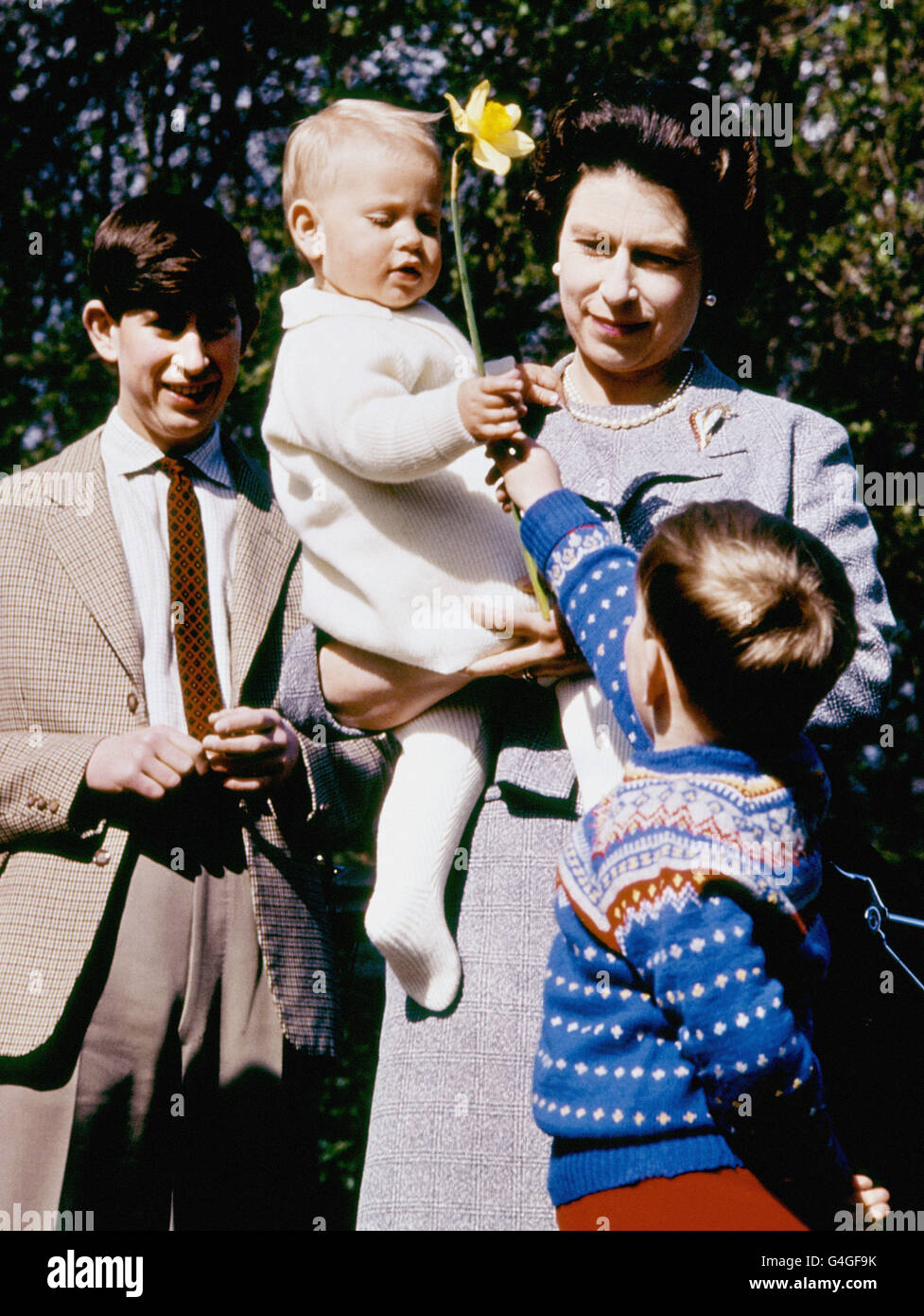 Prince Andrew offers his brother Prince Edward, being carried by his