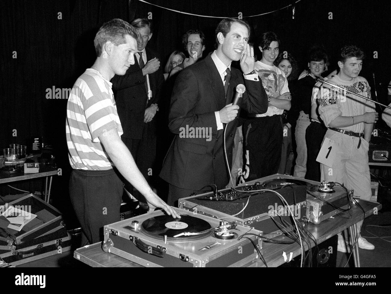 HRH Prince Edward takes over from DJ Andi Bird (left) at a 24 hour sponsored disco dance in Basildon. Monies raised will be shared between local youth group and the duke of Edinburgh's Award special projects committee of which the prince is Chairman. Stock Photo