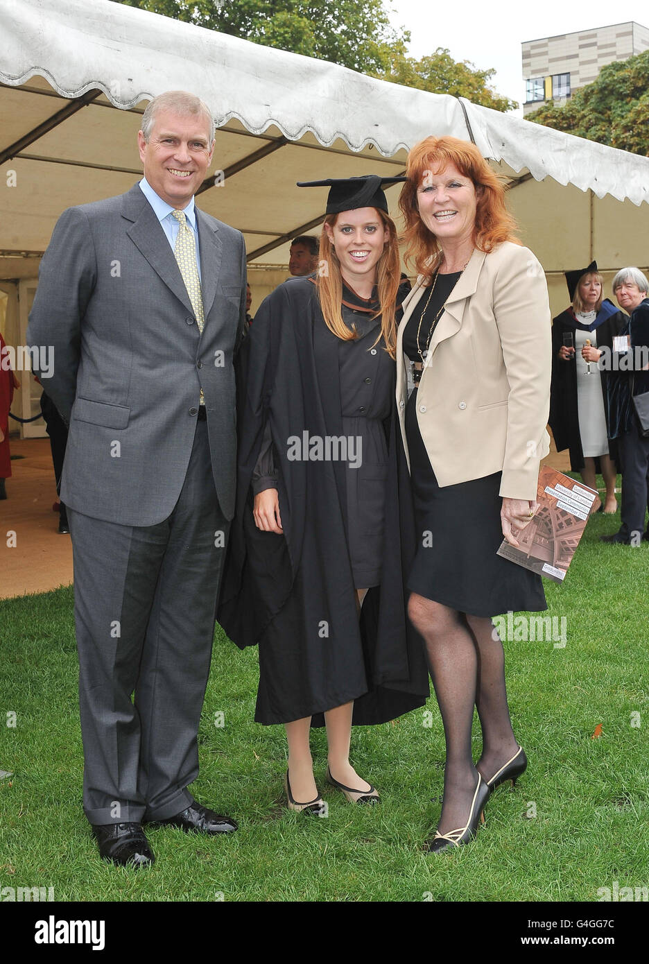 The Duke York (left) and Sarah, Duchess of York (right) meet their daughter, Princess Beatrice (centre), following her graduation ceremony at Goldsmiths College, London. Stock Photo