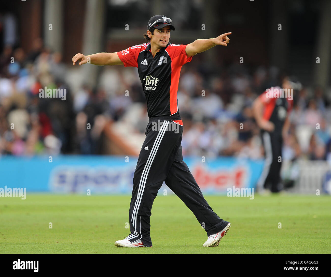 England's Captain Alastair Cook makes field placings during the game against India. Stock Photo