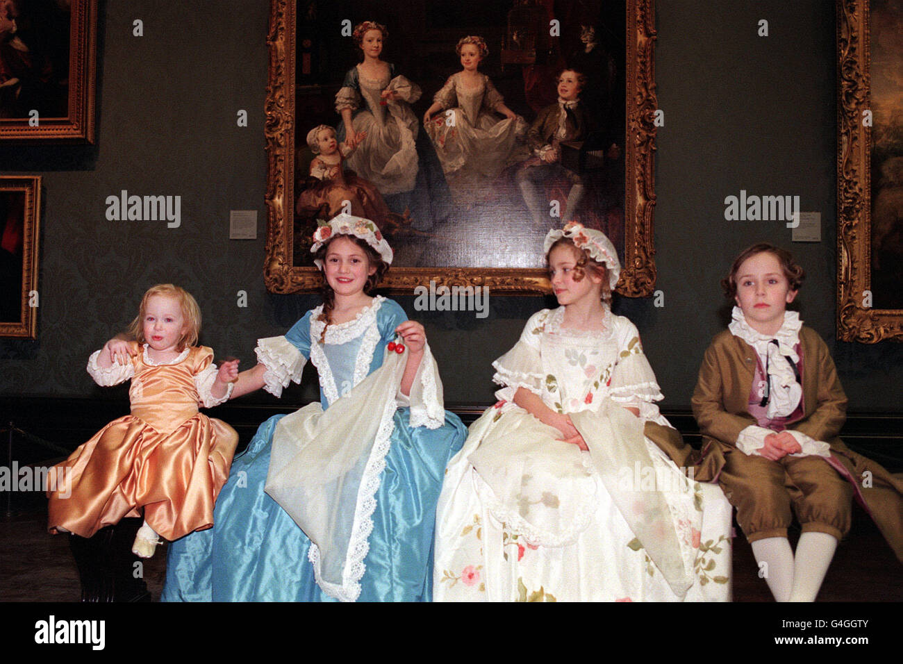 Children model costumes designed by Alison Graham & Kirtie Pritchard from the Wimbledon School of Art, at the National Gallery, from the painting 'The Graham Children' by Hogarth. Students held a Costume Parade with designs taken from paintings in the Gallery. Stock Photo