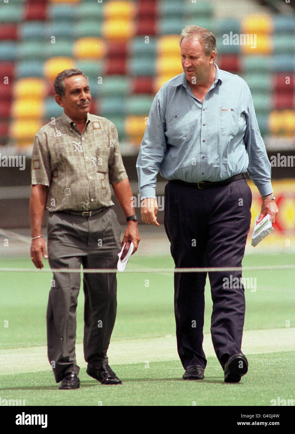 The two umpires for tomorrow's first Test, K T Francis of Sri Lanka (left) and Australia's Darrell Hair, take a look at the ground in Brisbane today (Thursday). Photo By BEN CURTIS/PA. Stock Photo
