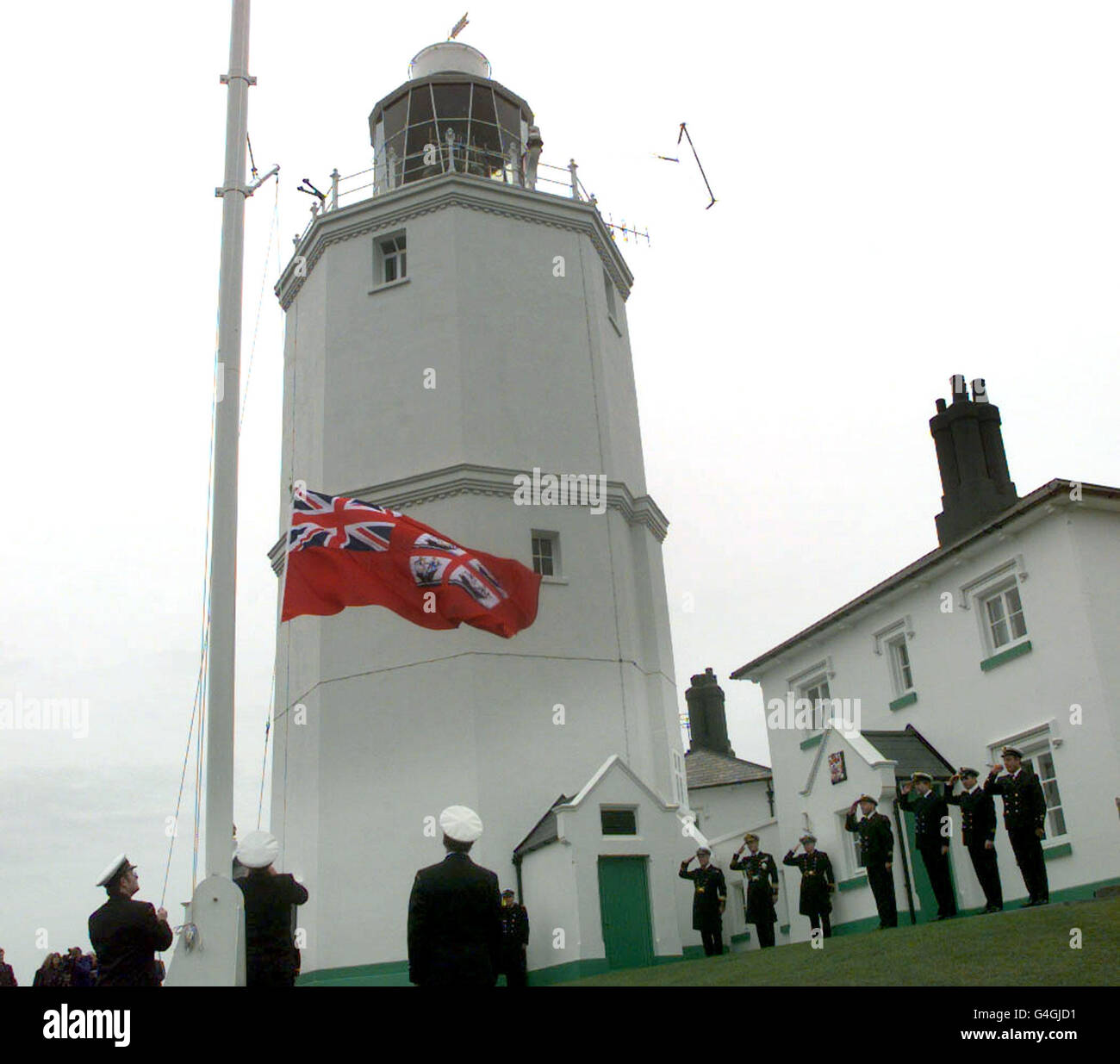 The flag at North Foreland Lighthouse in Kent, is lowered during a ceremony today Thursday 26 November,1998 to mark the end of the last manned lighthouse after 400 years WPA ROTA Photo by Stefan Rousseau/PA Stock Photo