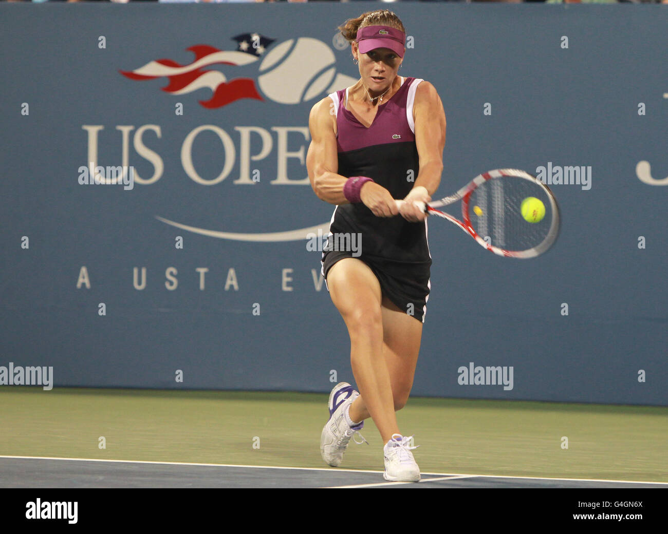 Australia's Samantha Stosur in action against Russia's Nadia Petrova during day five of the US Open at Flushing Meadows, New York, USA. Stock Photo