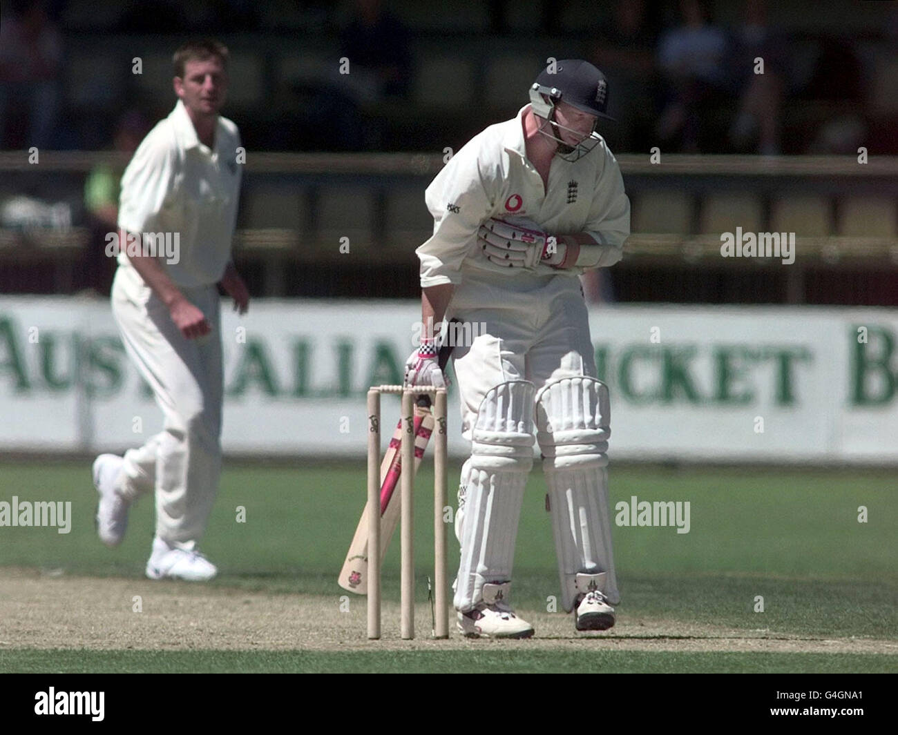 England's Michael Atherton clutches his chest after being hit by a ball