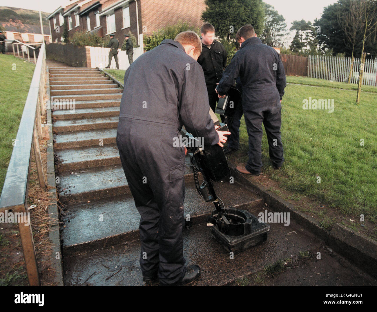 Police officers of the Royal Ulster Constabulary using sophisticated detection equipment in