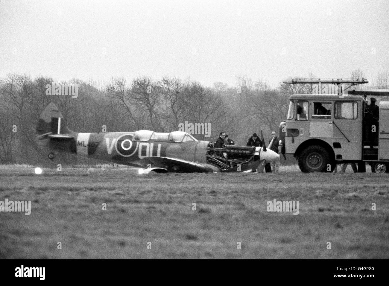 A Spitfire two-seater sits damaged on the runway at Eastleigh Airport after it's undercarriage collapsed. The plane was due to take part in the 50th anniversary celebrations of the Spitfire Stock Photo