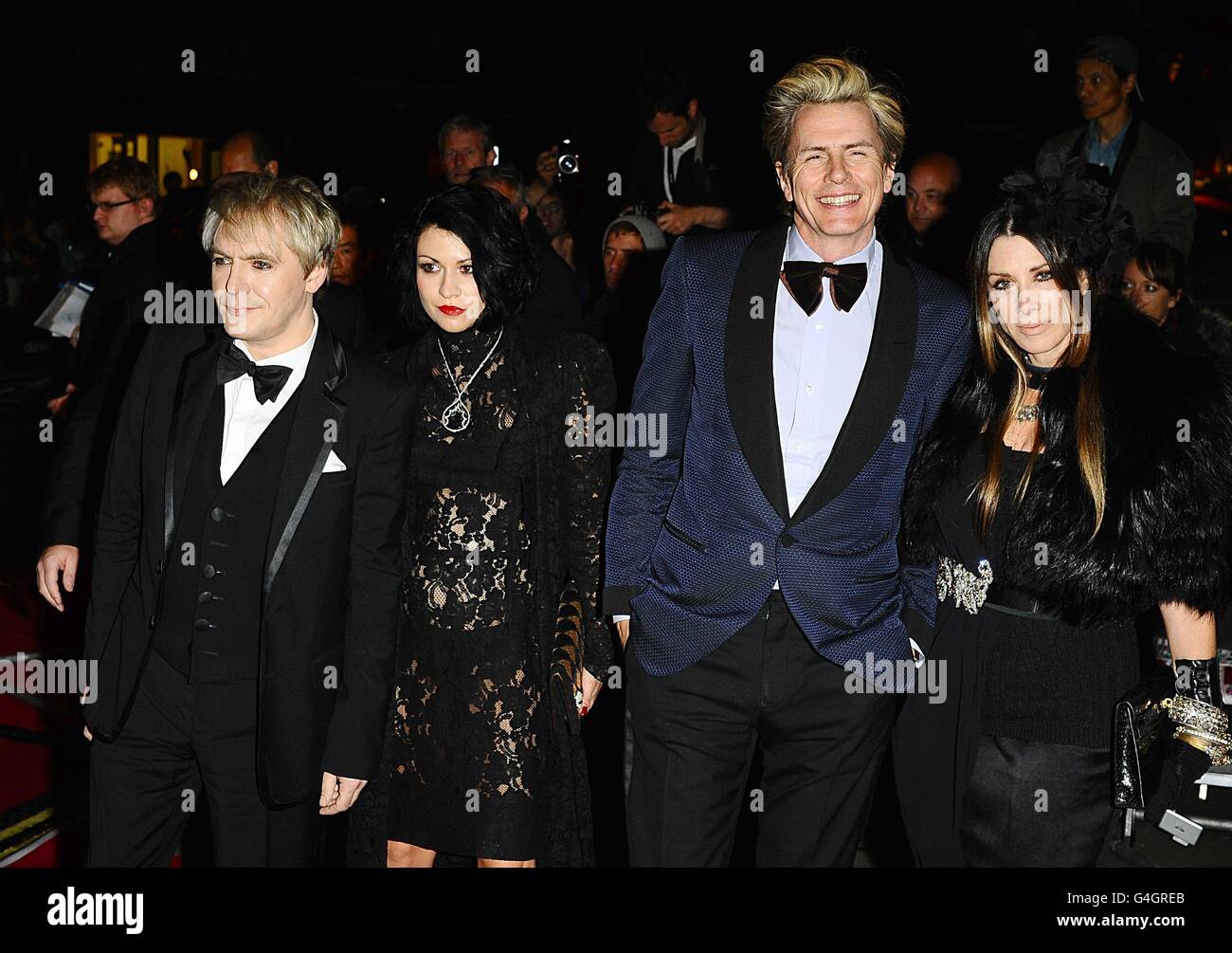 Nick Rhodes and guest with John Taylor and wife Gela Nash arriving for the 2011 GQ Men of the Year Awards at the Royal Opera House, Covent Garden, London. Stock Photo
