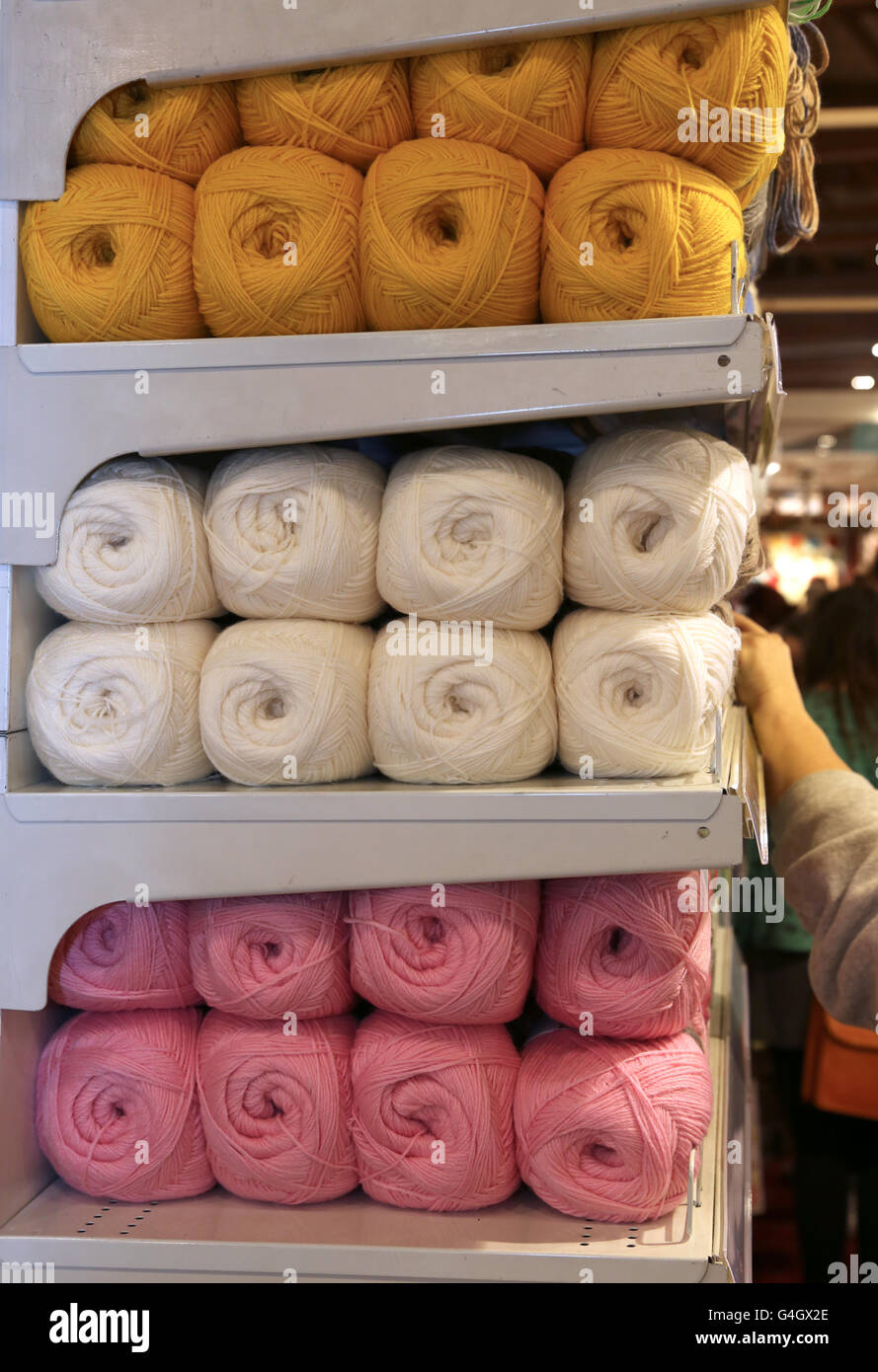 balls of wool for sale on the shelf in the wholesaler's shop Stock Photo