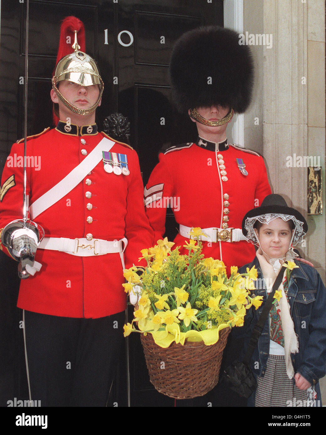 Daffodil charity girl & guardsmen Stock Photo Alamy
