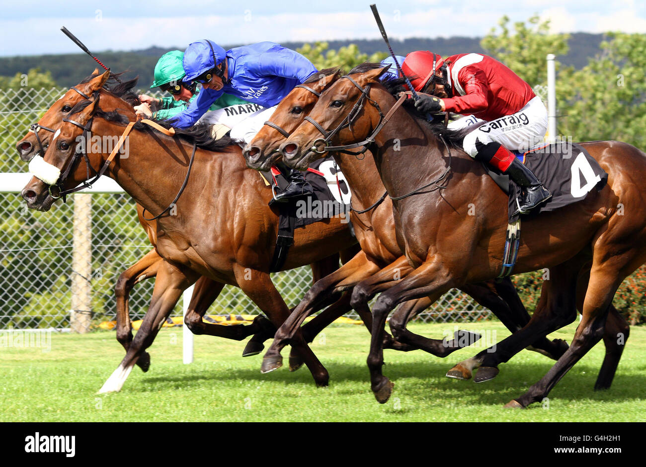 (left to right) Questing ridden by William Buick, Rakasa ridden by Frankie Dettori, Regal Realm ridden by Jimmy Fortune and Nayarra ridden by Kieron Fallon, race for a photo finish during The Whiteley Clinic Prestige Stakes at Goodwood Racecourse, Chichester. Stock Photo