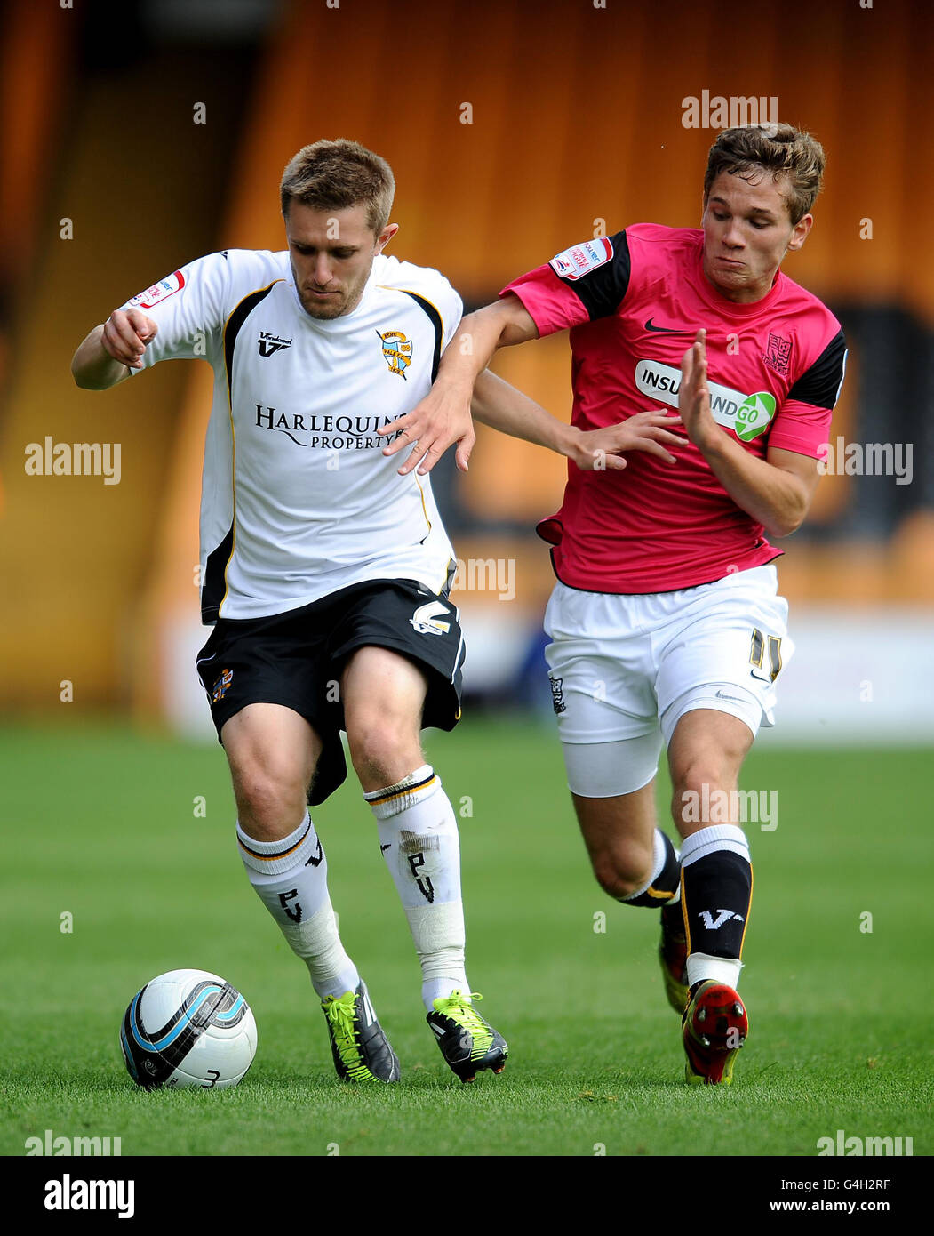 Port Vale's Adam Yates and Southend's Lee Sawyer (right) battle for the ball during the npower Football League Two match at Vale Park, Stoke On Trent. Stock Photo