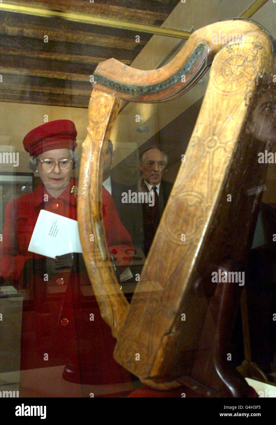 The Queen views Mary's Harp, a 15th century harp reputedly owned by