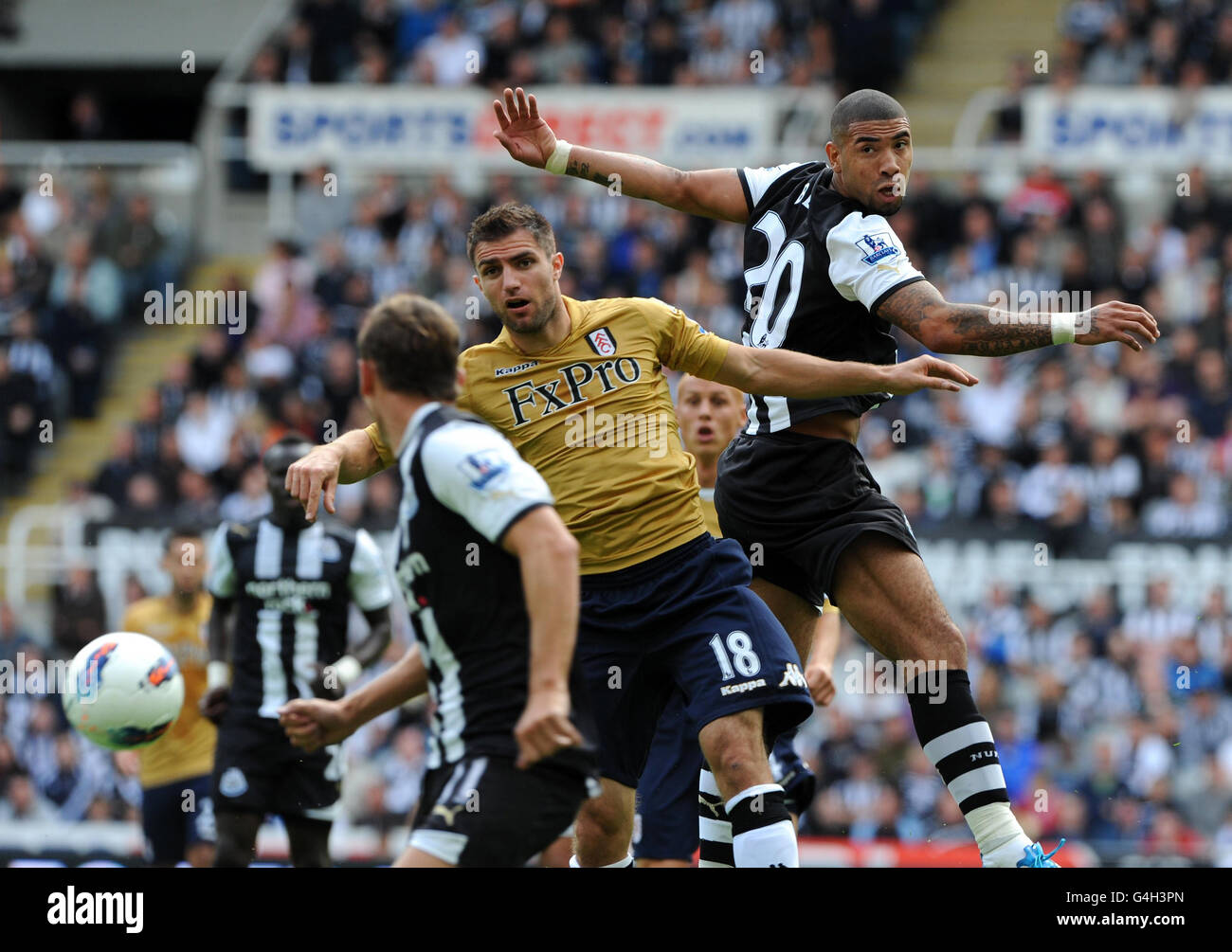 Newcastle's Leon Best (right) and Fulhams Aaron Hughes in action during