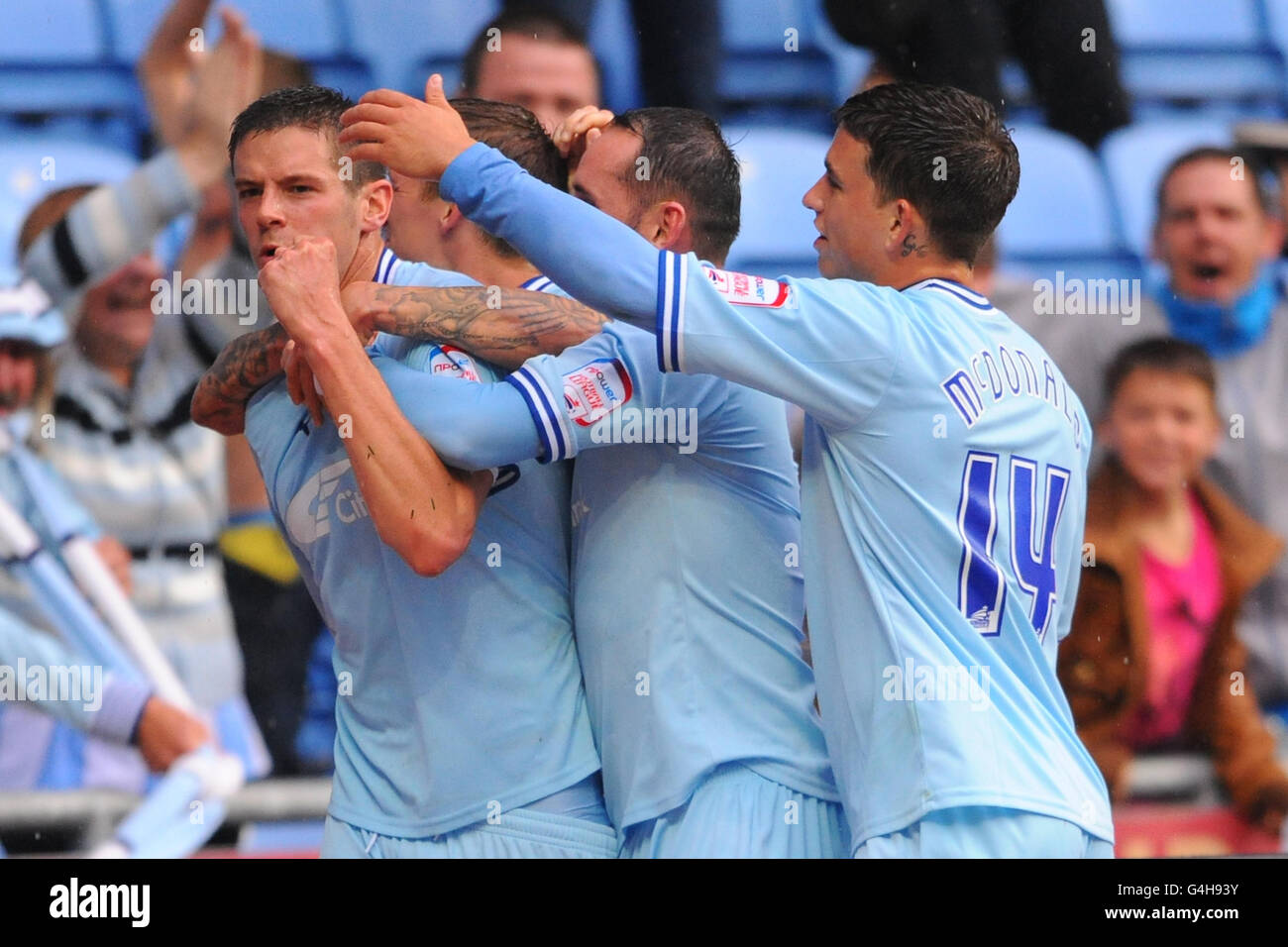 Coventry City's Lukas Jutkiewicz (left) celebrates scoring from the penalty spot during the npower Football League Championship match at the Ricoh Arena, Coventry. Stock Photo