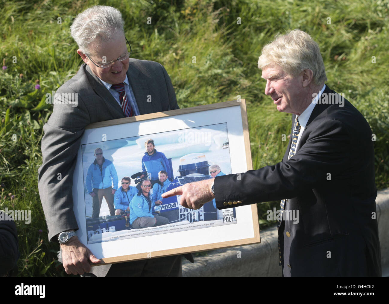 Scottish Environment minister Stewart Stevenson (left) meets explorer Jock Wishart to congratulate him on his and his crews success in reaching the North Pole in a rowing boat, outside the Scottish parliament Edinburgh. Stock Photo