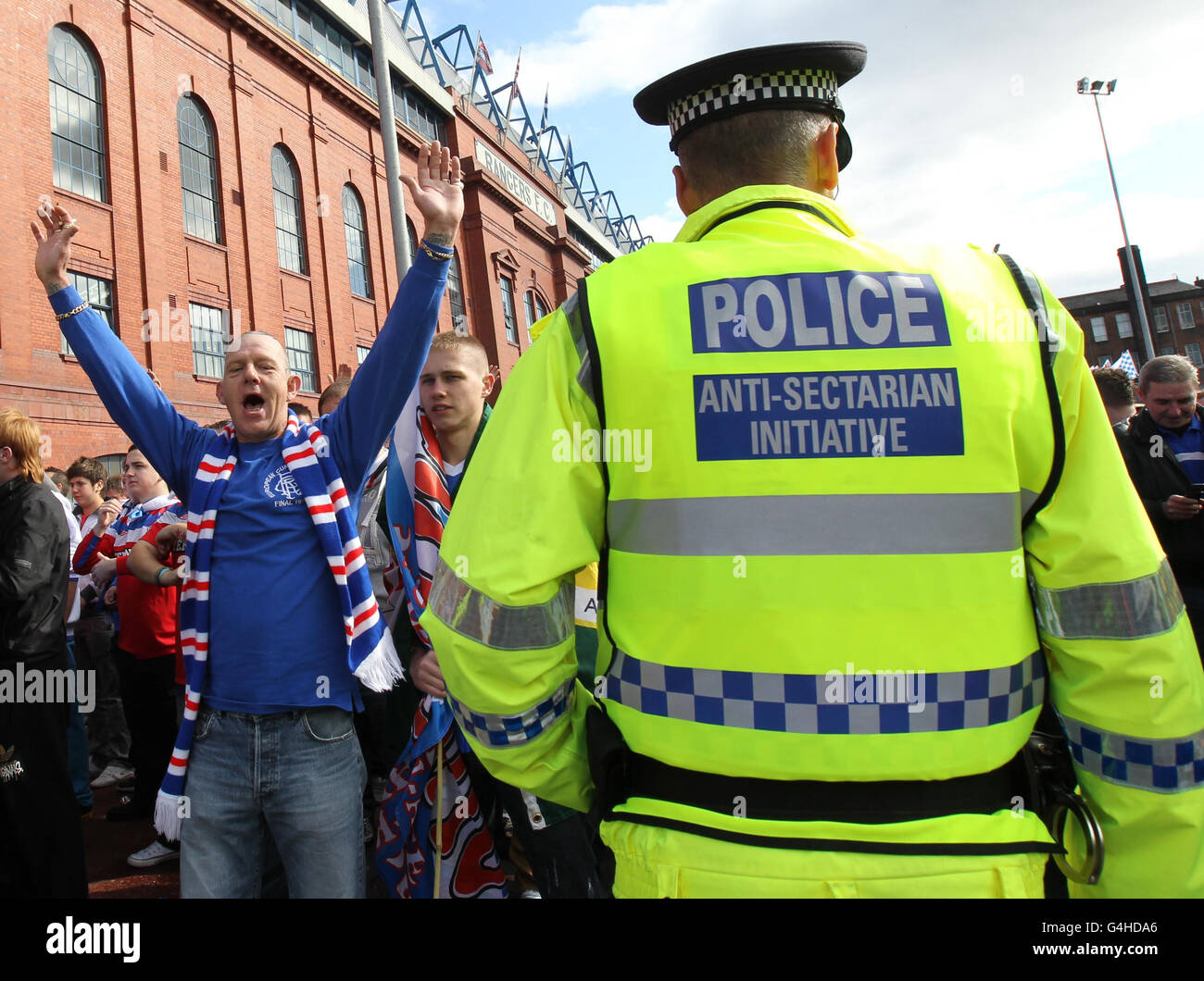Police watch Rangers fans arrive outside the ground prior to the Clydesdale Bank Scottish