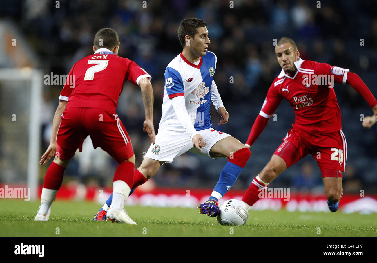 Blackburn's Ruben Rochina (centre) in action with Leyton Orient's Dean Cox and Jimmy Smith (right) during the Carling Cup, Third Round match at Ewood Park, Blackburn. Stock Photo