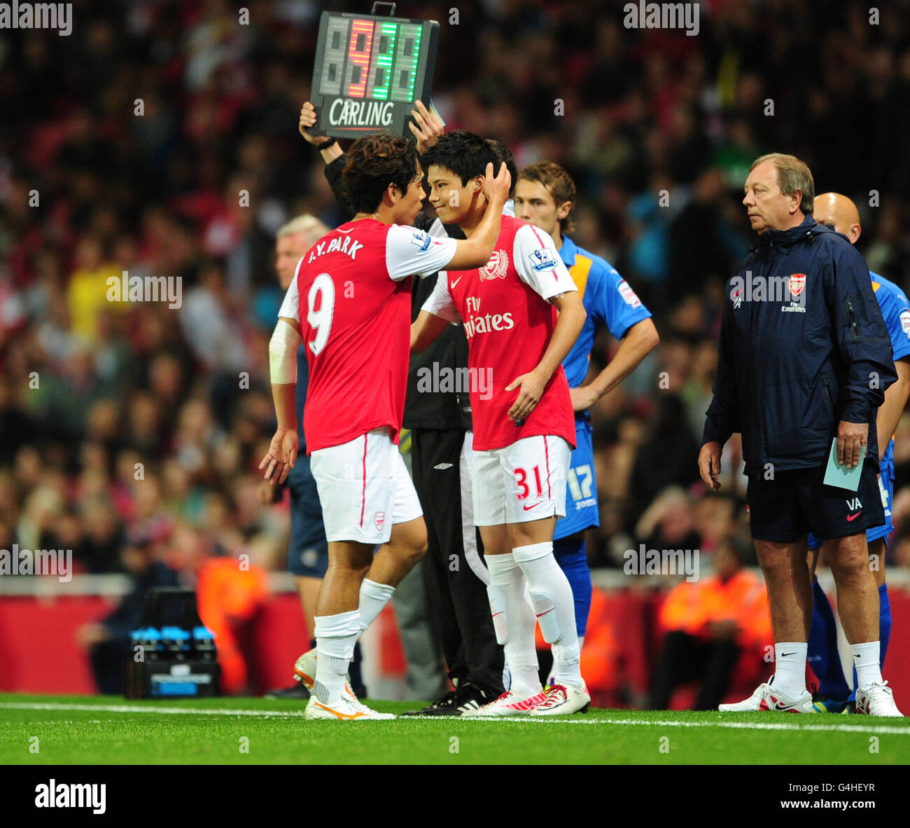 Soccer - Carling Cup - Third Round - Arsenal v Shrewsbury Town - Emirates Stadium. Arsenal's Ryo Miyaichi (right) comes on for team mate Chu Young Park (left) Stock Photo