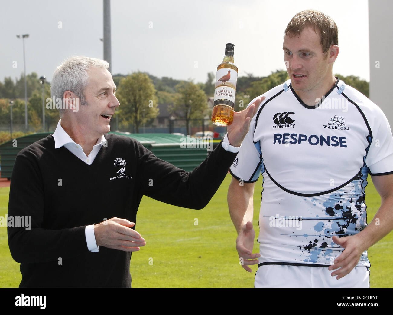 Glasgow Warriors' Al Kellock (right) with Famous Grouse Brand Heritage Director Derek Brown during a photocall to announce their sponsorship deal at Scotstoun Stadium, Glasgow. Stock Photo
