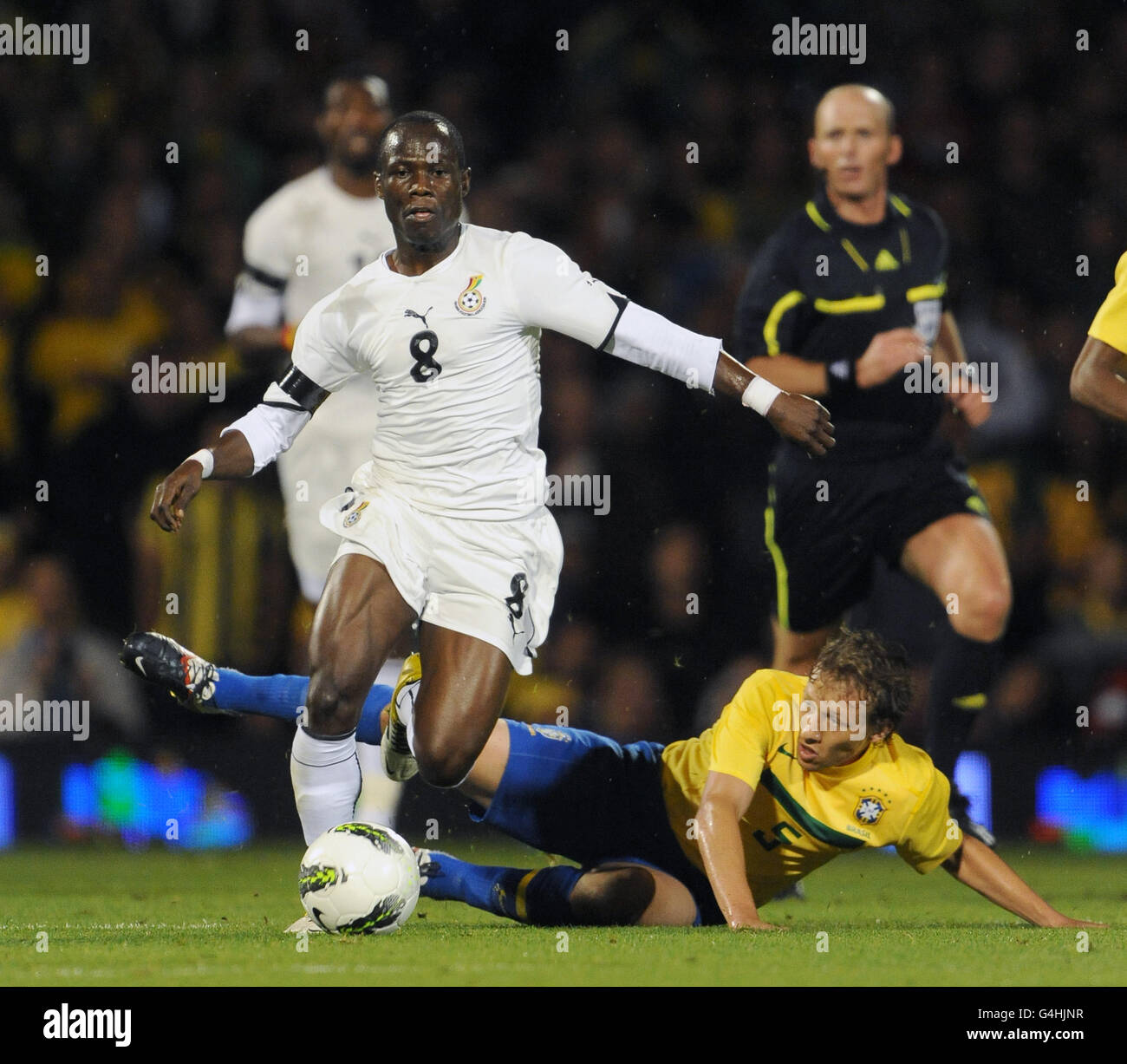 Brazil's Lucas Leiva and Ghana's Emmanuel Agyemang-Badu (left) battle for the ball Stock Photo