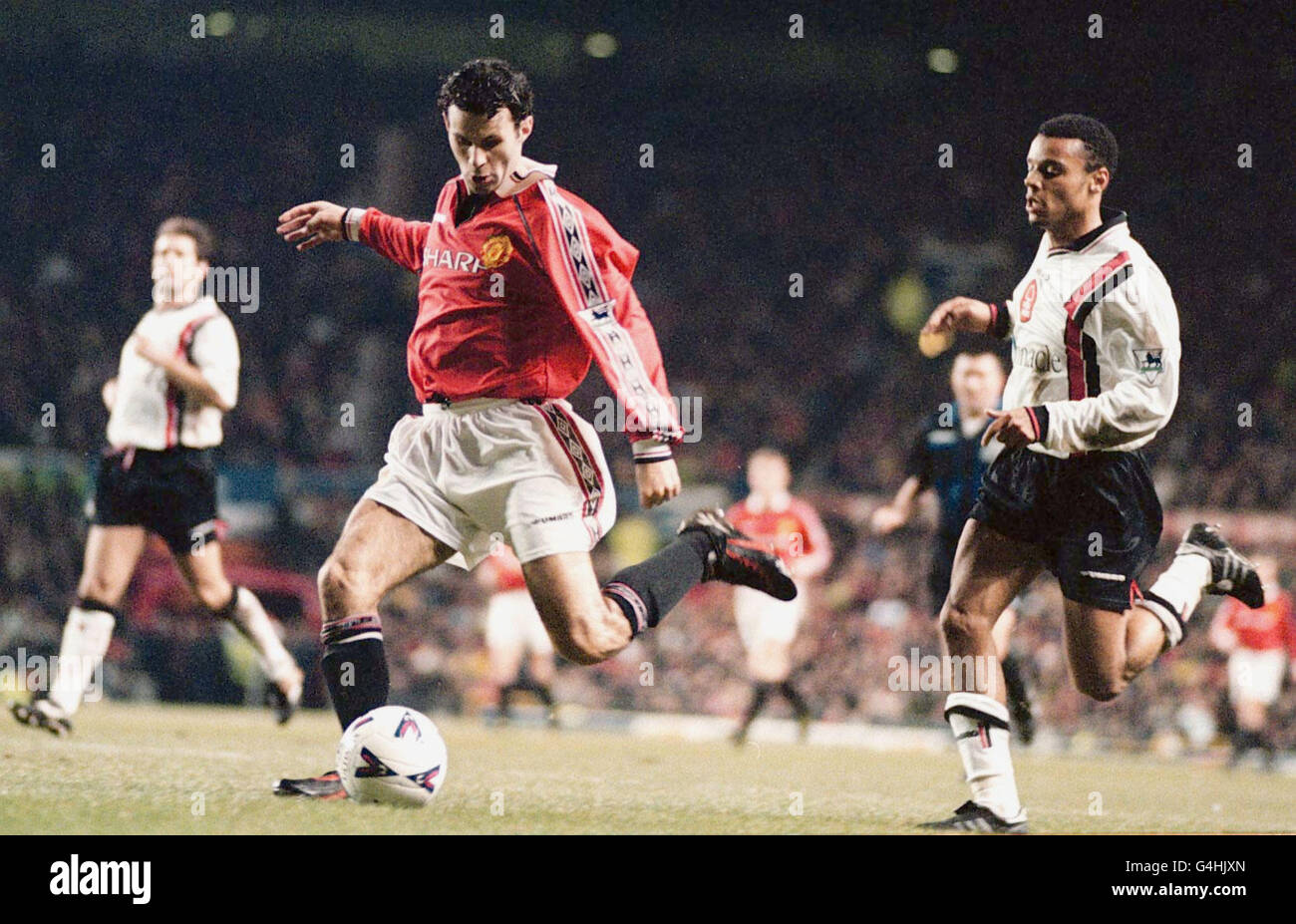 Ryan Giggs shoots to score for ManchesterUnited against Nottingham Forest during their FA Premiership football match at Old Trafford, Manchester. Stock Photo