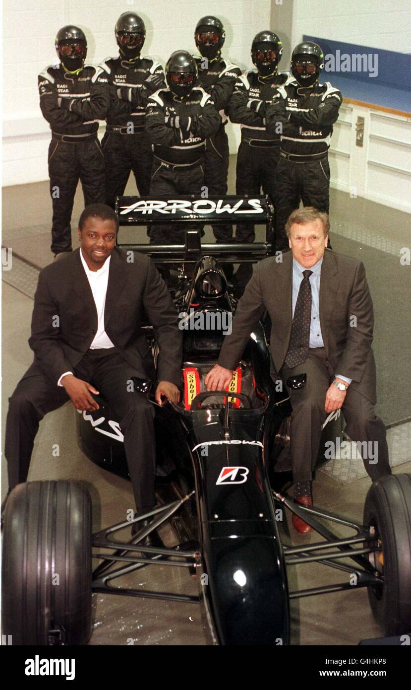 Tom Walkinshaw (R) and Prince Ado Ibrahim with the Arrows team at TWR's Headquarters in Leafield, Oxfordshire where the Formula One team has been bought by a consortium of bankers - Morgan Grenfell Private Equity and Prince Ado Ibrahim. Stock Photo
