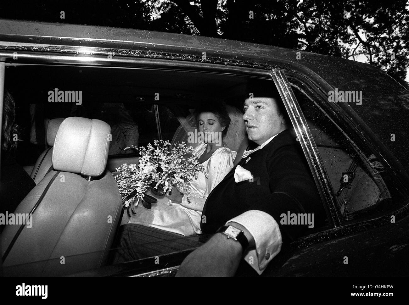 PA NEWS PHOTO 14/9/84 EARL JERMYN (29) HEIR TO THE MARQUIS OF BRISTOL, AND HIS BRIDE, THE FROMER FRANCESCA FISHER, DAUGHTER OF A MARBELLA PROPERTY CONSULTANT DRIVE AWAY FROM THE ESTATE CHURCH AT ICKWORTH AFTER THE WEDDING CEREMONY Stock Photo