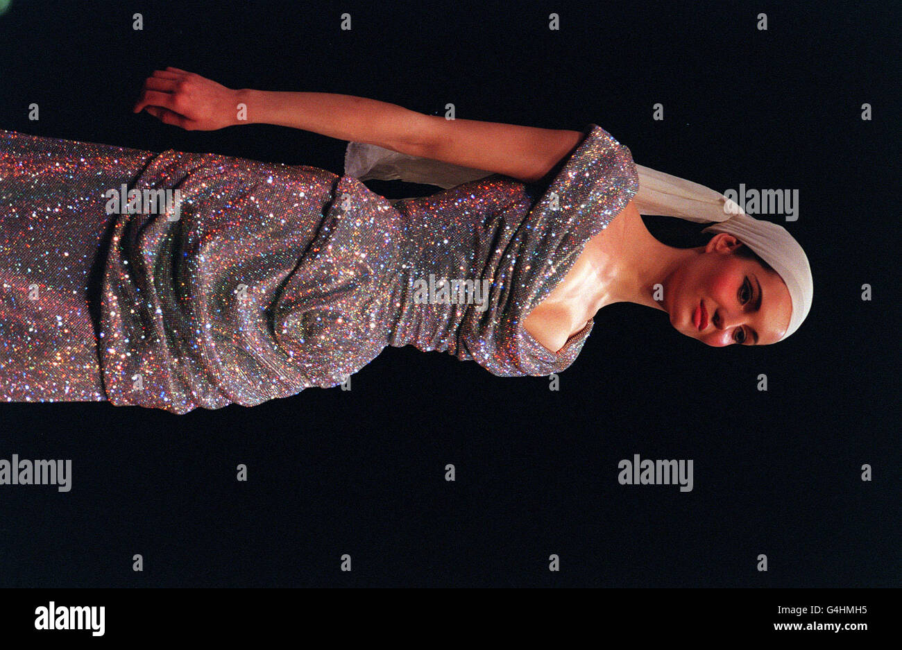 A model presents a sequinned evening dress from the Vivienne Westwood  Spring/Summer collection at the Scottish Exhibition and Conference Centre  in Glasgow, the first time that Ms Westwood has shown her collection