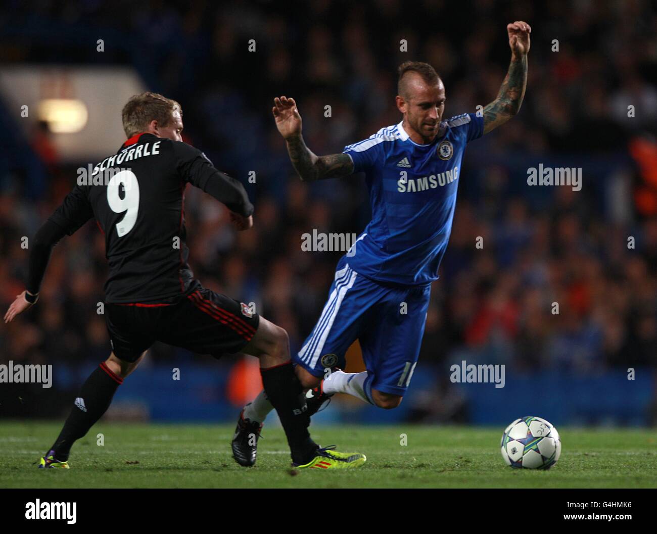 Chelsea's Raul Meireles is brought down by Bayer Leverkusen's Andre Schurrle Stock Photo
