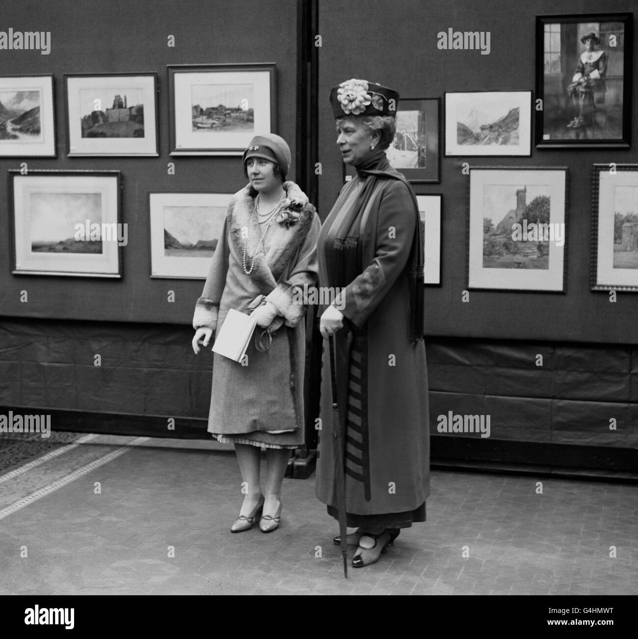 Queen Mary and the Duchess of York (later the Queen Mother) at a Civil Service art exhibition. Stock Photo